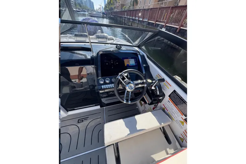 Slide: The Image of Interior of 2026 Granfort 300 GTX boat with modern seating and audio system. - 5