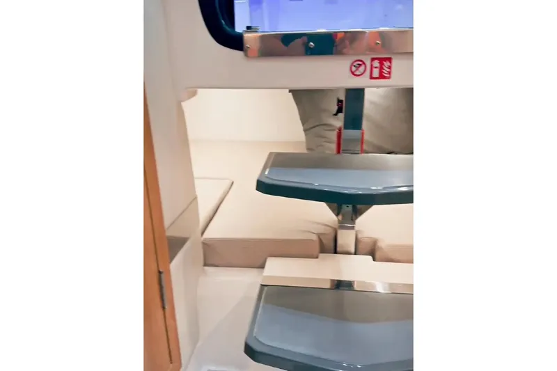 Slide: The Image of 2026 Granfort 300 GTX boat cruising near city skyline on a sunny day. - 9