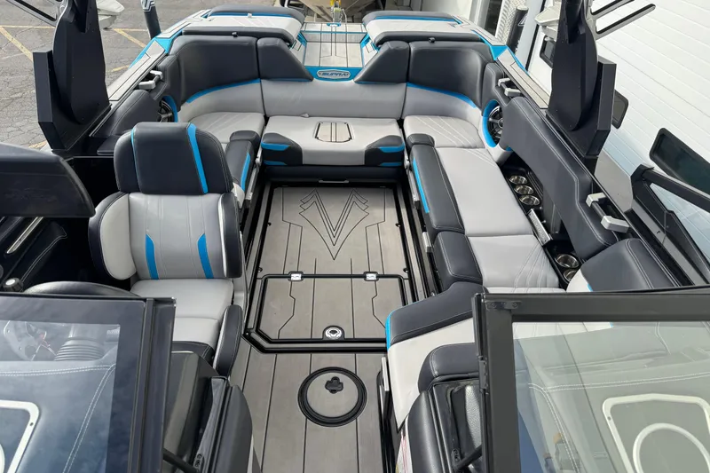 Slide: The Image of 2021 Supra SA 575 boat interior with luxurious seating and modern design. - 6