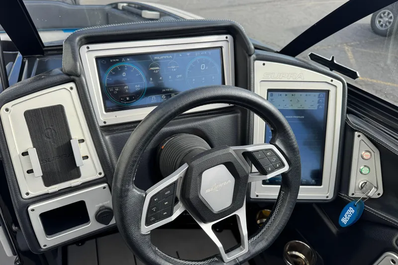Slide: The Image of 2021 Supra SA 575 dashboard with digital displays and steering wheel controls. - 7