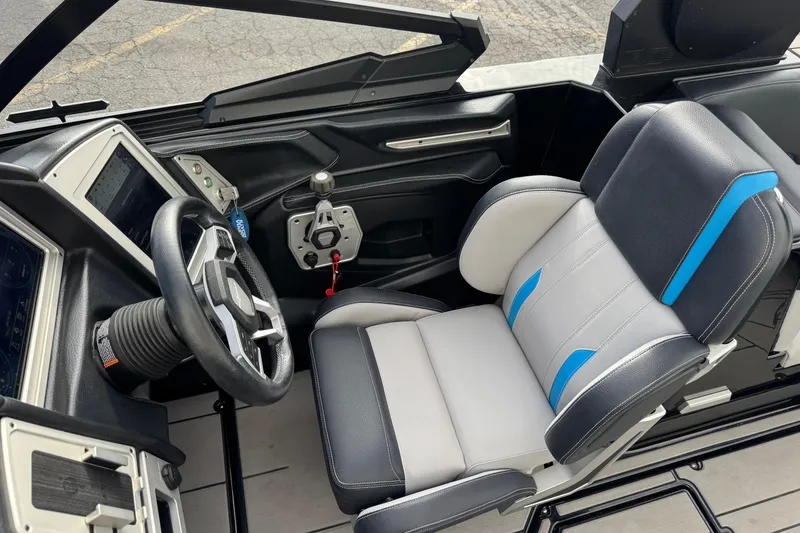 Slide: The Image of 2021 Supra SA 575 boat interior with steering wheel and modern dashboard. - 8