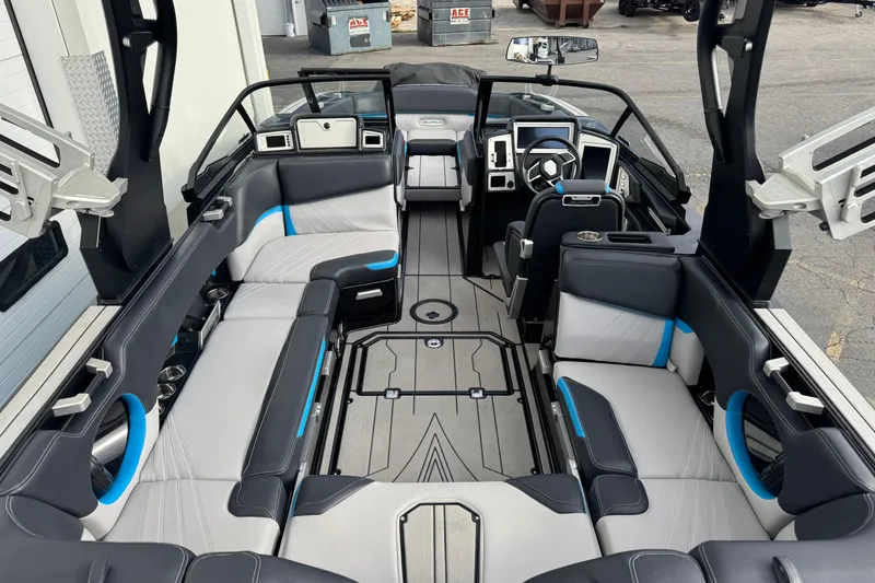 Slide: The Image of 2021 Supra SA 575 boat interior with modern seating and sleek design. - 9
