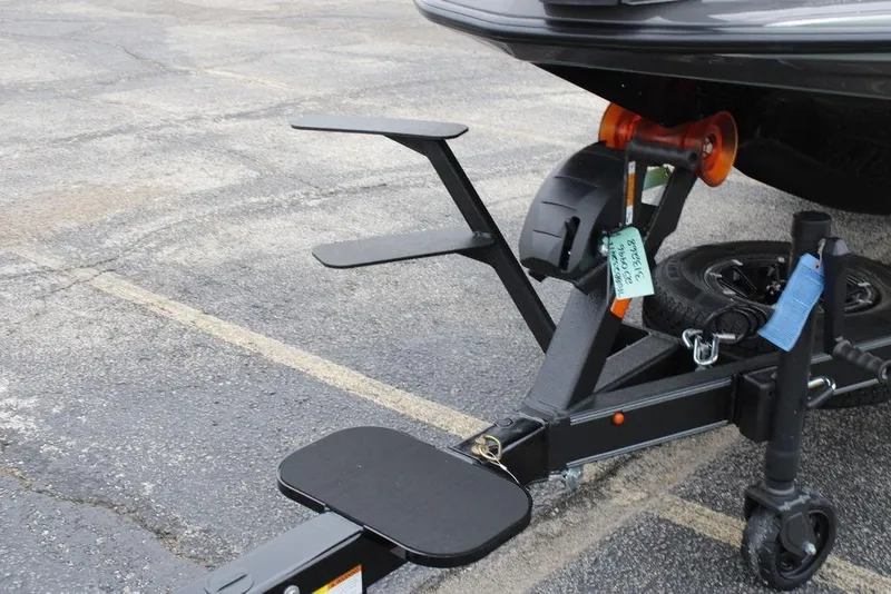 Slide: The Image of Trailer hitch of 2026 Skeeter ZXE20 boat on asphalt parking lot. - 1