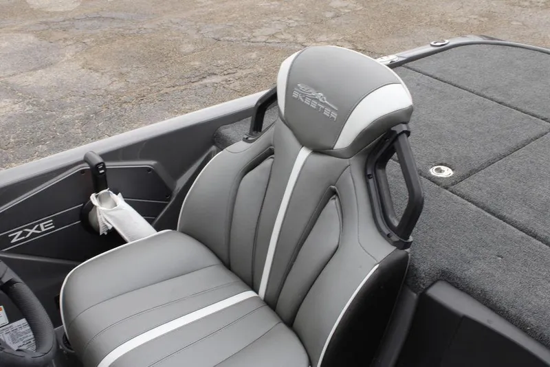 Slide: The Image of 2026 Skeeter ZXE20 boat interior with gray seating and sleek design. - 13