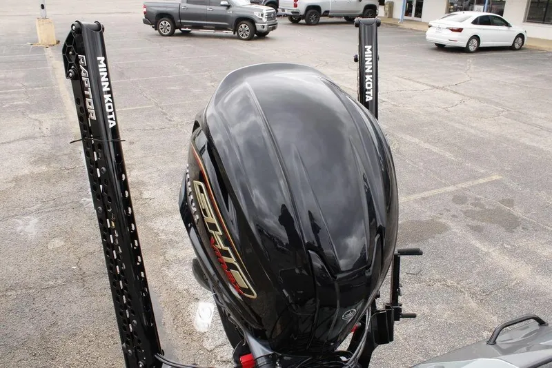Slide: The Image of 2026 Skeeter ZXE20 boat with Minn Kota Raptor anchors in a parking lot. - 19