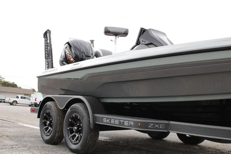 Slide: The Image of 2026 Skeeter ZXE20 boat on trailer, showcasing sleek design and powerful engine. - 21