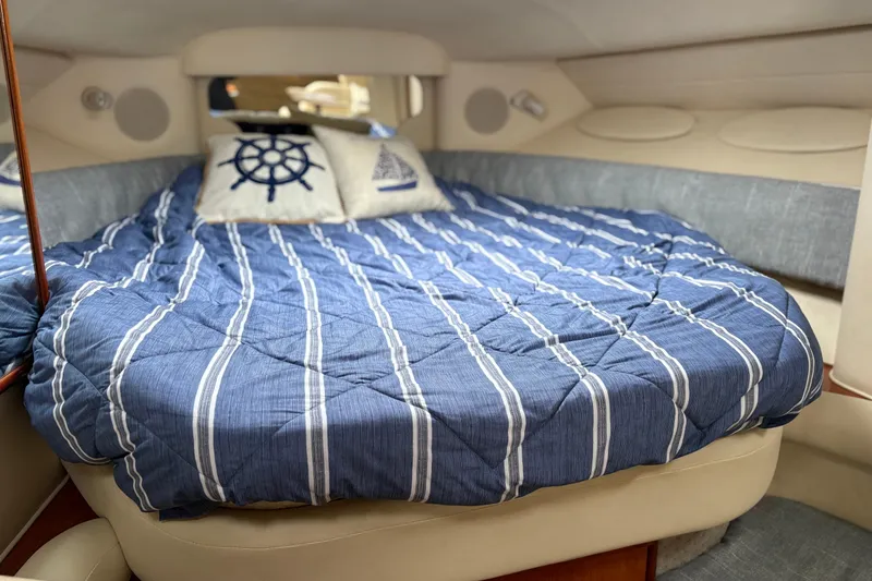 Slide: The Image of 2001 Sea Ray 340 Sundancer kitchen with stainless steel fridge and wooden cabinetry. - 11