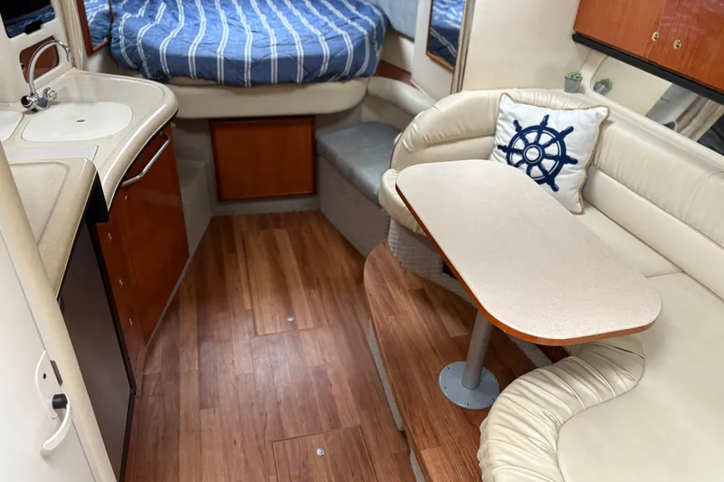 Slide: The Image of Wooden steps inside a 2001 Sea Ray 340 Sundancer yacht cabin. - 13