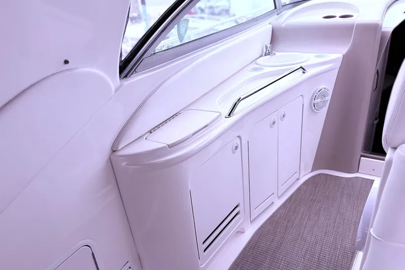 Slide: The Image of Cozy cabin interior of 2001 Sea Ray 340 Sundancer with nautical-themed bedding. - 15