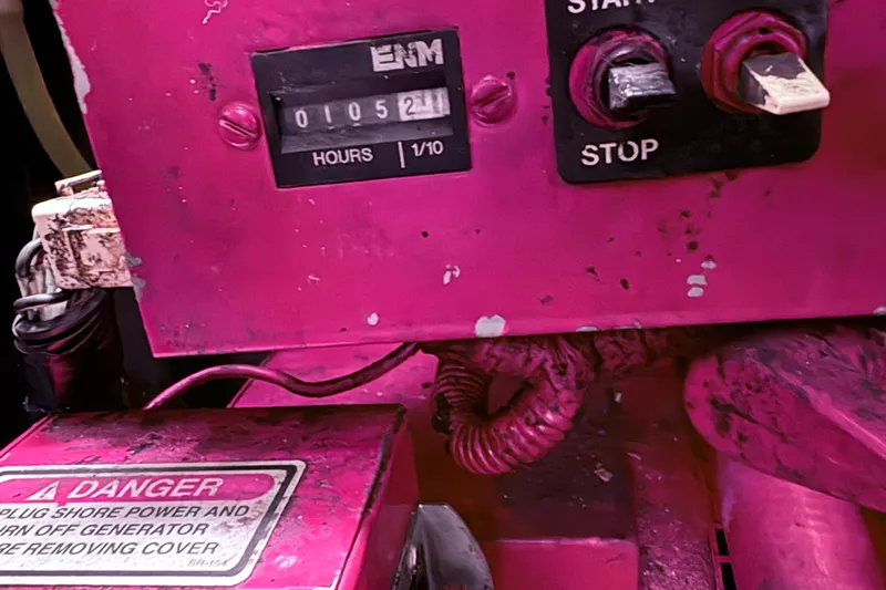 Slide: The Image of Control panel of a 2001 Sea Ray 340 Sundancer boat, showing engine hours and switches. - 22