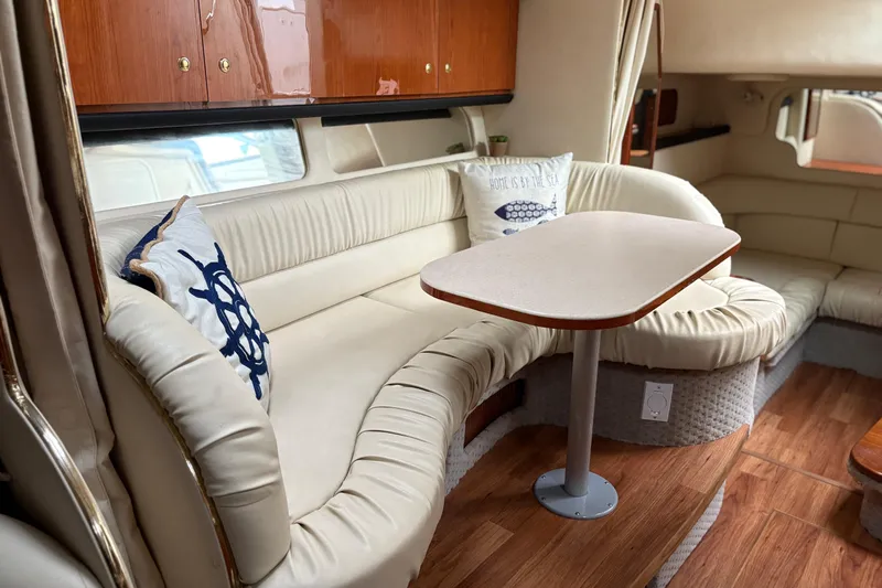 Slide: The Image of 2001 Sea Ray 340 Sundancer boat on stands in a marina parking lot. - 5