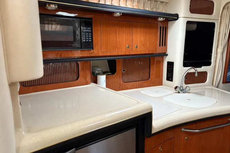 Slide: The Image of Interior view of 2001 Sea Ray 340 Sundancer boat with rain on windows. - 6