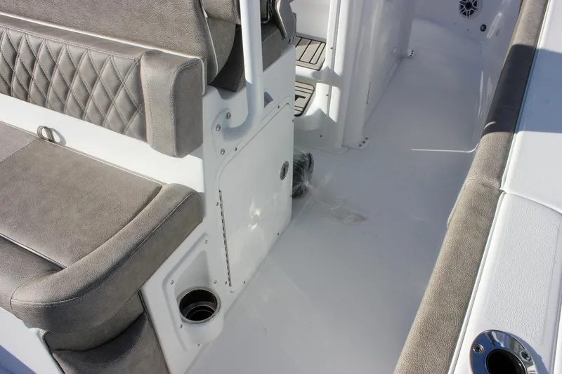 Slide: The Image of Interior view of 2026 Sea Hunt Ultra 265 SE boat with cushioned seating. - 12