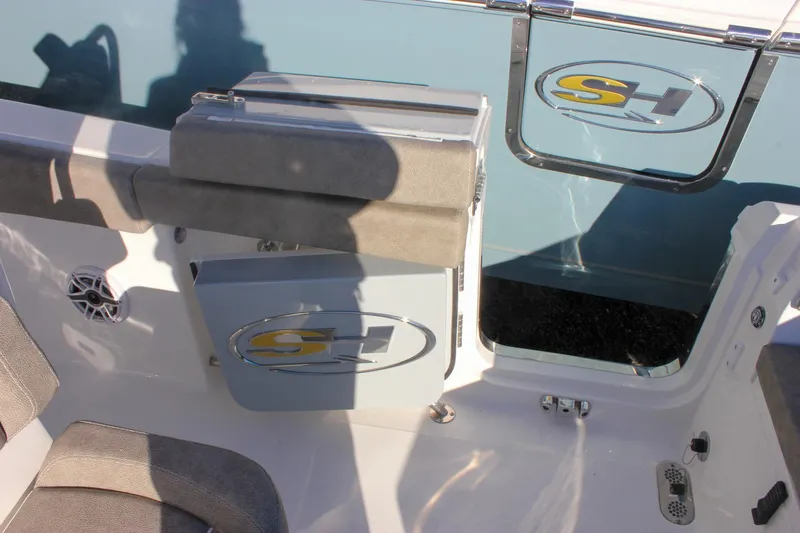 Slide: The Image of 2026 Sea Hunt Ultra 265 SE boat interior with seating and logo details. - 20