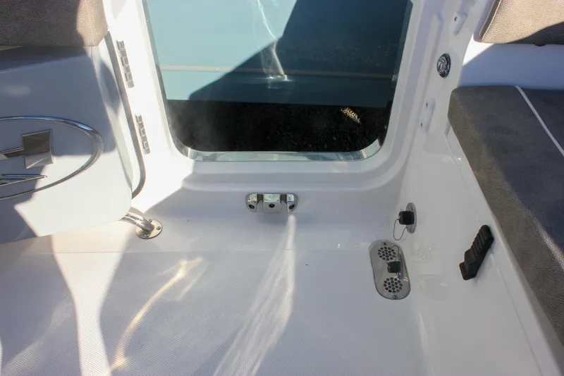 Slide: The Image of Interior view of 2026 Sea Hunt Ultra 265 SE boat, featuring seating and deck details. - 21