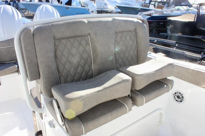 Slide: The Image of 2026 Sea Hunt Ultra 265 SE boat seat with gray upholstery and diamond stitching. - 23