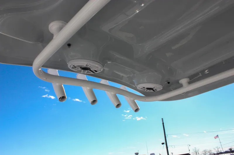 Slide: The Image of 2026 Sea Hunt Ultra 265 SE boat speakers and rod holders under clear blue sky. - 25