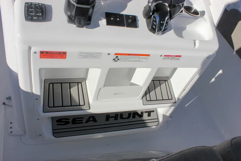 Slide: The Image of 2026 Sea Hunt Ultra 265 SE boat console with controls and branding. - 26