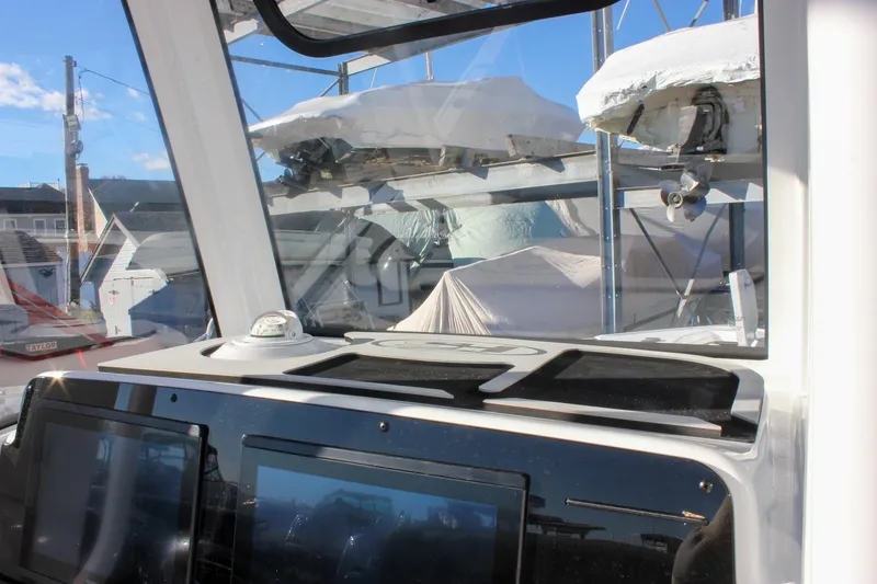 Slide: The Image of Interior view of 2026 Sea Hunt Ultra 265 SE boat dashboard with navigation screens. - 30