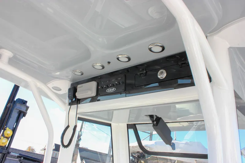 Slide: The Image of 2026 Sea Hunt Ultra 265 SE boat console with electronics and lighting. - 32