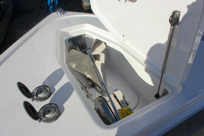 Slide: The Image of Open anchor compartment on 2026 Sea Hunt Ultra 265 SE boat. - 34
