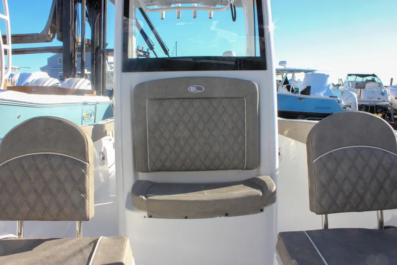 Slide: The Image of 2026 Sea Hunt Ultra 265 SE boat interior with cushioned seating and modern design. - 35