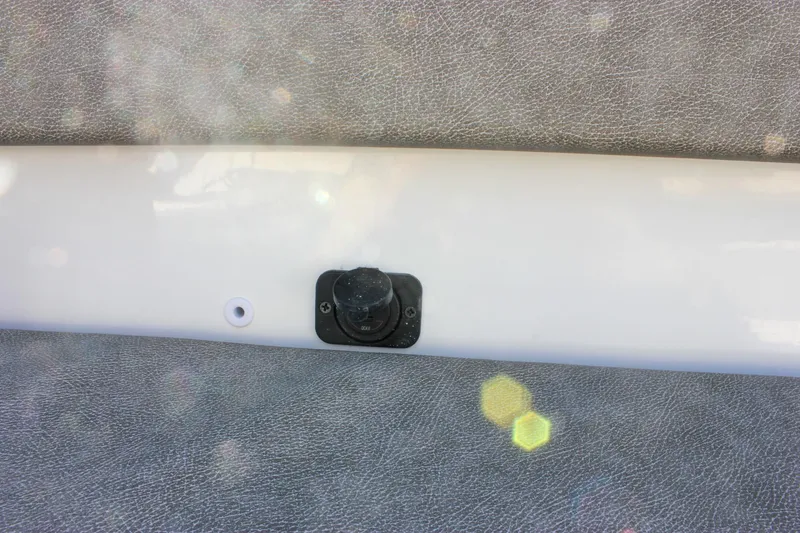 Slide: The Image of 2026 Sea Hunt Ultra 265 SE boat detail with a mounted black fixture. - 41