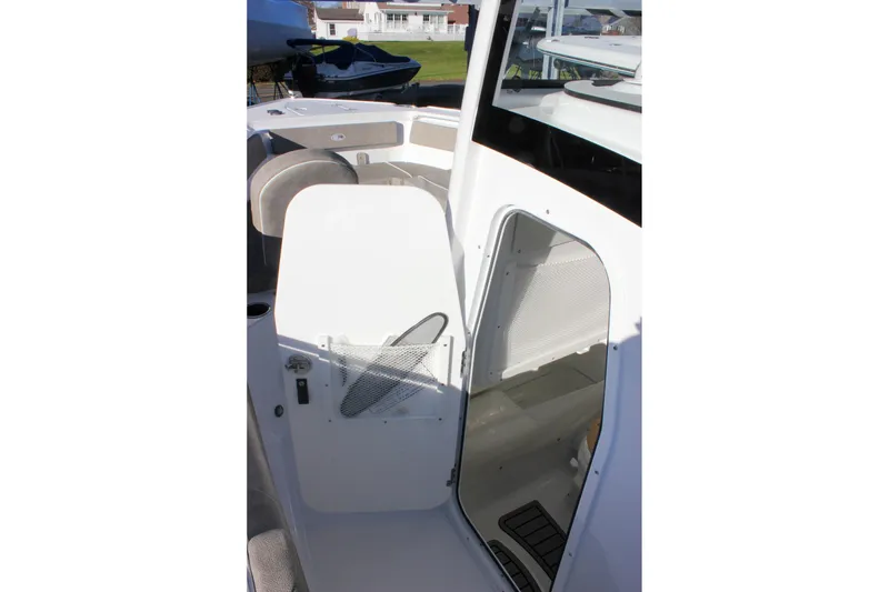 Slide: The Image of 2026 Sea Hunt Ultra 265 SE boat interior with open storage compartment. - 42