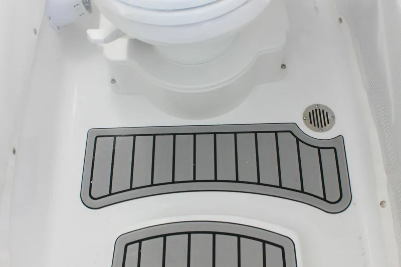 Slide: The Image of Interior of 2026 Sea Hunt Ultra 265 SE boat, featuring non-slip flooring and drainage. - 47