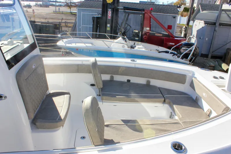 Slide: The Image of 2026 Sea Hunt Ultra 265 SE boat interior with cushioned seating and modern design. - 50