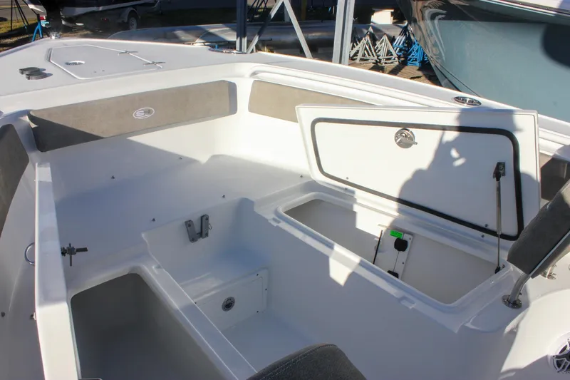 Slide: The Image of 2026 Sea Hunt Ultra 265 SE boat interior with open storage compartment. - 52