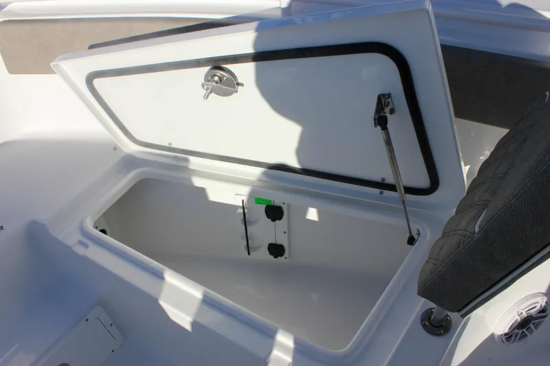 Slide: The Image of Open storage compartment on 2026 Sea Hunt Ultra 265 SE boat. - 53