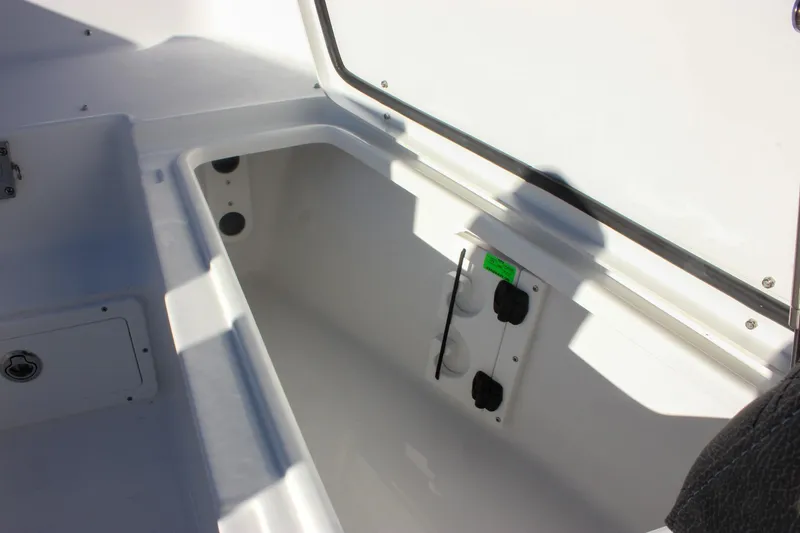 Slide: The Image of Storage compartment in 2026 Sea Hunt Ultra 265 SE boat. - 54