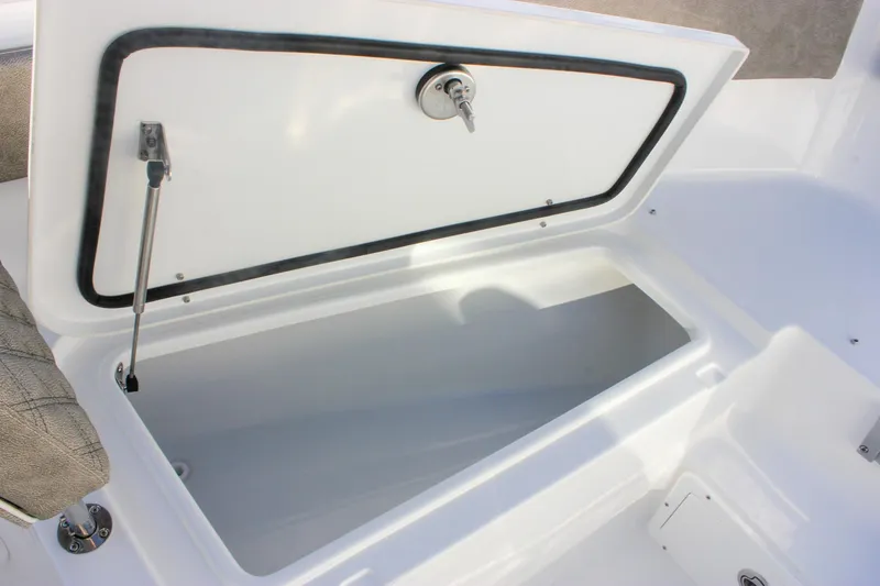 Slide: The Image of Open storage compartment on 2026 Sea Hunt Ultra 265 SE boat. - 55
