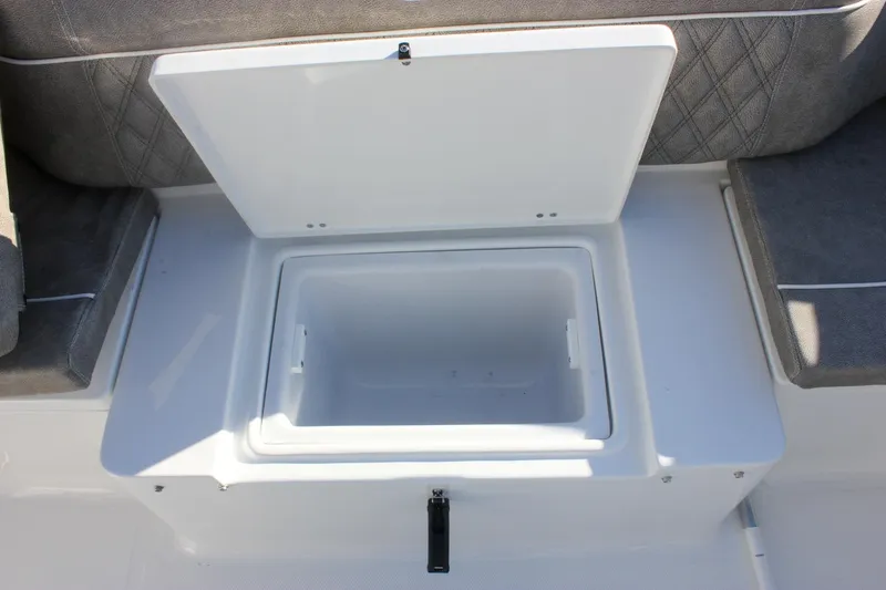 Slide: The Image of Open storage compartment on 2026 Sea Hunt Ultra 265 SE boat. - 6