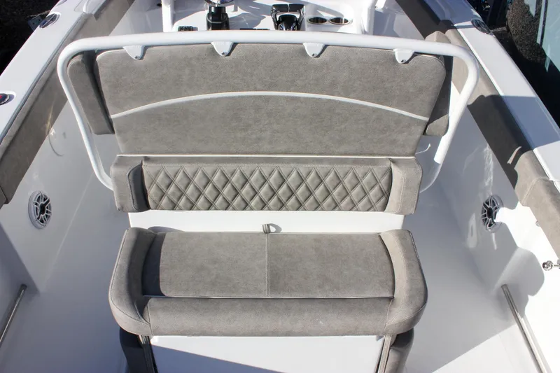 Slide: The Image of 2026 Sea Hunt Ultra 265 SE boat seating with gray upholstery and diamond stitching. - 7