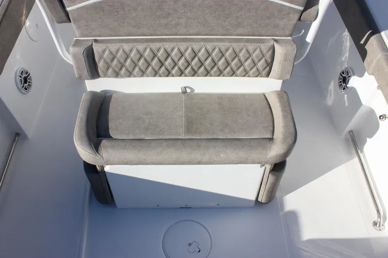 Slide: The Image of 2026 Sea Hunt Ultra 265 SE boat seating with gray upholstery and diamond stitching. - 8