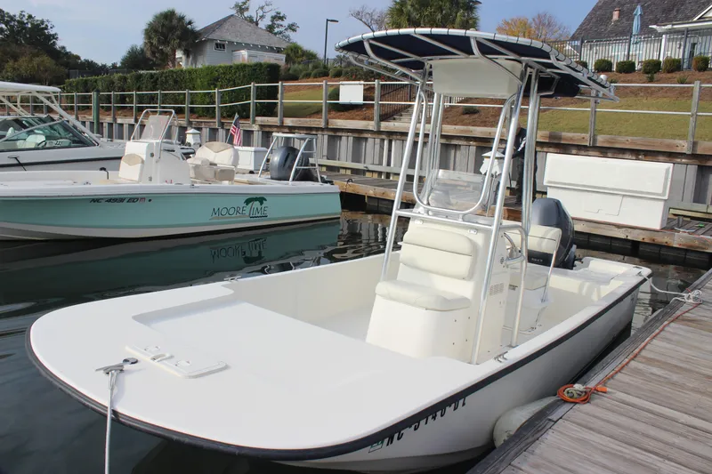 Slide: The Image of 2014 Key West 177 Skiff boat docked at a marina. - 11
