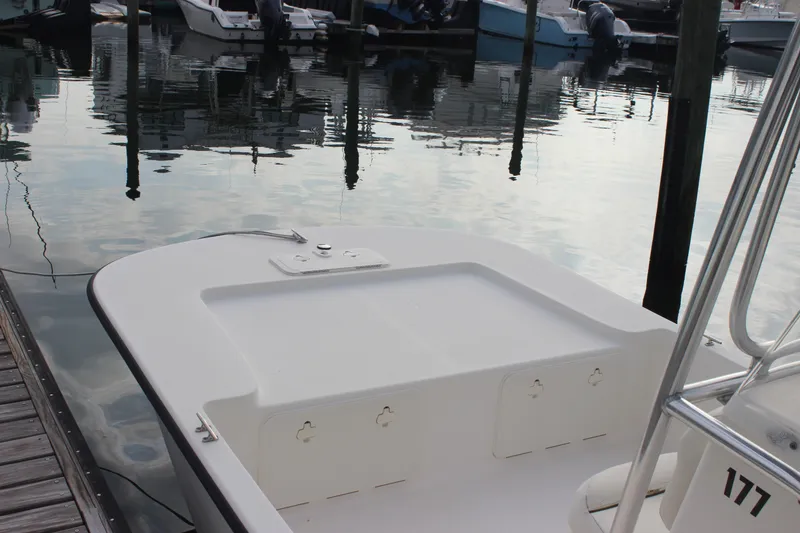 Slide: The Image of 2014 Key West 177 Skiff boat docked at marina, calm water reflections. - 15