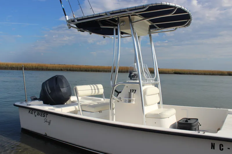 Slide: The Image of 2014 Key West 177 Skiff boat on calm water with clear sky. - 5