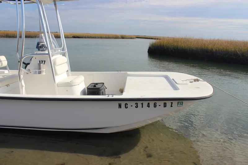 Slide: The Image of 2014 Key West 177 Skiff boat docked in shallow water, side view. - 6