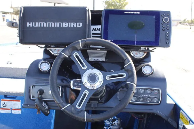 Slide: The Image of 2019 Nitro Z20 boat dashboard with Humminbird electronics and steering wheel. - 17