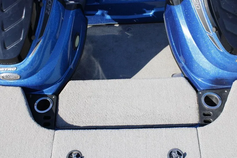 Slide: The Image of 2019 Nitro Z20 boat interior with blue accents and carpeted flooring. - 20