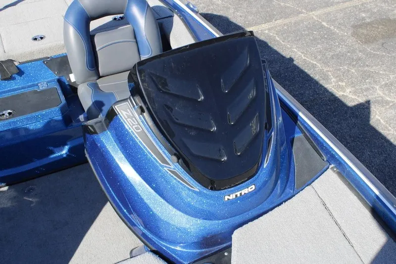 Slide: The Image of 2019 Nitro Z20 boat cockpit with blue metallic finish and cushioned seat. - 21