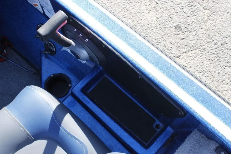 Slide: The Image of 2019 Nitro Z20 boat interior with control lever and blue seating. - 22