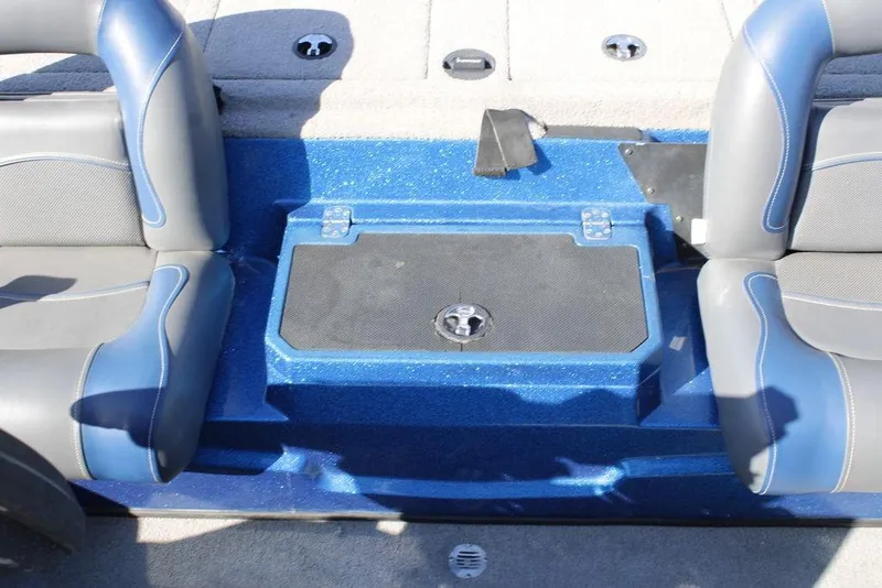 Slide: The Image of 2019 Nitro Z20 boat interior with blue and gray seating and storage compartment. - 23