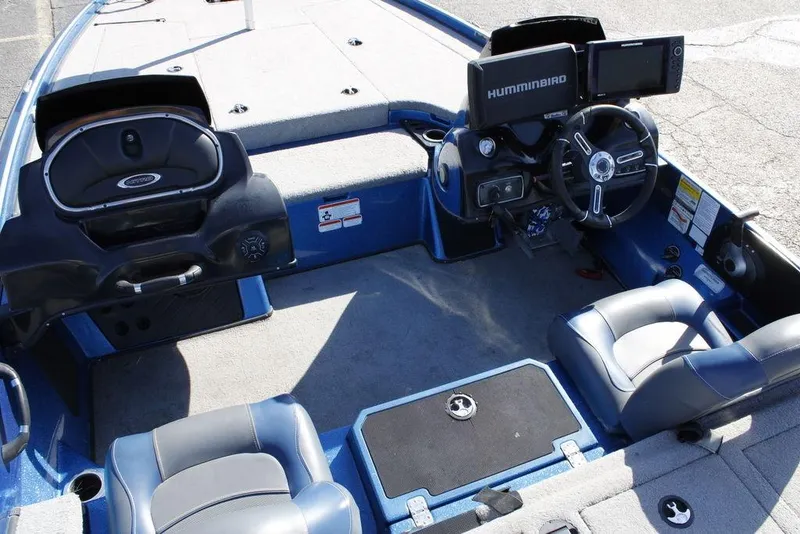 Slide: The Image of Interior of a 2019 Nitro Z20 boat with steering console and seating. - 24