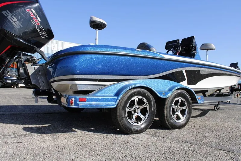 Slide: The Image of 2019 Nitro Z20 boat with blue glitter finish and dual-axle trailer. - 27