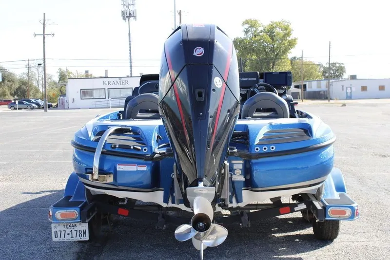 Slide: The Image of 2019 Nitro Z20 boat with powerful outboard motor in a parking lot. - 4