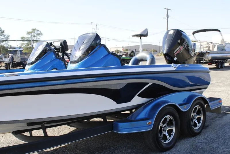 Slide: The Image of 2019 Nitro Z20 blue and white boat with dual consoles and trailer. - 8
